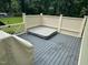 Relaxing outdoor hot tub on a wooden deck, surrounded by a white lattice fence for privacy at 6553 Vintage Ridge Ln, Fuquay Varina, NC 27526