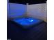 Corner hot tub on a dark wood deck is surrounded by a white lattice privacy fence at 6553 Vintage Ridge Ln, Fuquay Varina, NC 27526