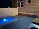 Relaxing hot tub and outdoor grill space are featured on this deck, combining comfort and entertainment in a private backyard at 6553 Vintage Ridge Ln, Fuquay Varina, NC 27526