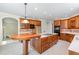 Beautiful kitchen with custom cabinetry, island cooktop, and modern appliances for culinary enthusiasts at 6553 Vintage Ridge Ln, Fuquay Varina, NC 27526