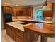 Spacious kitchen with custom wood cabinets, a center island, and updated appliances at 6553 Vintage Ridge Ln, Fuquay Varina, NC 27526