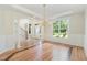 Elegant living room boasts hardwood floors, detailed trim, and large windows for natural light at 6553 Vintage Ridge Ln, Fuquay Varina, NC 27526