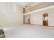 Spacious living room with a loft, fireplace, and natural light at 6553 Vintage Ridge Ln, Fuquay Varina, NC 27526