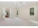 Expansive main bedroom with a ceiling fan, ample natural light, and an en-suite bathroom at 6553 Vintage Ridge Ln, Fuquay Varina, NC 27526