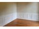 Light and airy home office featuring hardwood floors and decorative wall trim at 6553 Vintage Ridge Ln, Fuquay Varina, NC 27526