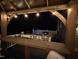 Outdoor entertainment area under a covered space featuring a grill and bar height counter at 6553 Vintage Ridge Ln, Fuquay Varina, NC 27526