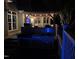 Luxurious outdoor kitchen with grill and comfortable seating is set under a pergola with mounted tv for elevated outdoor enjoyment at 6553 Vintage Ridge Ln, Fuquay Varina, NC 27526