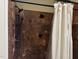 Tiled shower featuring a rainfall showerhead and a handheld sprayer at 6553 Vintage Ridge Ln, Fuquay Varina, NC 27526