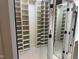 Large walk-in closet with ample shelving and a mirrored door at 6553 Vintage Ridge Ln, Fuquay Varina, NC 27526