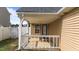 Cozy back porch, perfect for outdoor relaxation, featuring seating and an adjacent fenced yard at 6920 Moss Creek Way, Rocky Mount, NC 27804