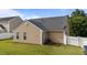 A home's exterior with a well maintained lawn, and partial fencing at 6920 Moss Creek Way, Rocky Mount, NC 27804