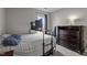Bedroom with a desk with a gaming computer, wood furniture, soft carpet, and a natural light window at 6920 Moss Creek Way, Rocky Mount, NC 27804