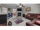 Open-concept living room with fireplace and dining area. Perfect for modern living at 6920 Moss Creek Way, Rocky Mount, NC 27804