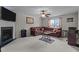 Spacious living room boasts a fireplace and plush seating, perfect for relaxation and entertaining at 6920 Moss Creek Way, Rocky Mount, NC 27804