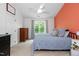 Well-lit bedroom with a comfy bed, wood dresser, and ceiling fan at 6924 Coventry Ridge Rd, Raleigh, NC 27616