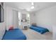 Shared bedroom with two twin beds, ample natural light, and playful decor creating a cozy atmosphere at 6924 Coventry Ridge Rd, Raleigh, NC 27616