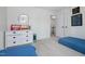 bedroom with dresser, wall decor, and two twin beds, creating a playful and inviting space at 6924 Coventry Ridge Rd, Raleigh, NC 27616