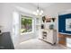 Bright breakfast nook with large windows overlooking the backyard and modern fixtures at 6924 Coventry Ridge Rd, Raleigh, NC 27616