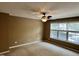 Spacious bedroom with ceiling fan and large windows providing abundant natural light, perfect for relaxation and rest at 7331 Bonnie Ridge Ct, Raleigh, NC 27615