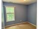 Comfortable bedroom with natural light streaming through the window, creating a serene and inviting atmosphere at 7331 Bonnie Ridge Ct, Raleigh, NC 27615