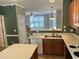 Kitchen featuring wood cabinets, island and open floorplan at 7331 Bonnie Ridge Ct, Raleigh, NC 27615