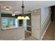 Kitchen featuring wood cabinets, island and staircase at 7331 Bonnie Ridge Ct, Raleigh, NC 27615