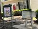 Community mailboxes with a fresh spring advertisement and well-maintained surroundings at 7331 Bonnie Ridge Ct, Raleigh, NC 27615