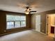 Bright main bedroom with ceiling fan and ample windows offering a comfortable retreat with plenty of natural light at 7331 Bonnie Ridge Ct, Raleigh, NC 27615