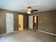 Expansive main bedroom with multiple doorways and neutral decor, providing a blank canvas for personalization at 7331 Bonnie Ridge Ct, Raleigh, NC 27615