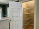 Pantry with shelving in the kitchen at 7331 Bonnie Ridge Ct, Raleigh, NC 27615