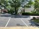 Community street view with well-maintained parking spaces and landscaping at 7331 Bonnie Ridge Ct, Raleigh, NC 27615