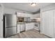 Modern kitchen featuring stainless steel appliances and ample cabinet space at 7731 Kingsberry Ct, Raleigh, NC 27615