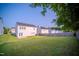 Wide shot of a big backyard with a wooden fence and green grass at 8021 Wesley Farm Dr, Raleigh, NC 27616