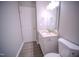Modern bathroom with a single granite vanity and stylish fixtures at 8021 Wesley Farm Dr, Raleigh, NC 27616