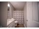 Bathroom with granite countertops, single vanity, and modern shower curtain at 8021 Wesley Farm Dr, Raleigh, NC 27616