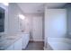 Bathroom featuring a dual vanity with granite countertops and modern fixtures at 8021 Wesley Farm Dr, Raleigh, NC 27616