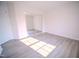 Bedroom featuring modern sliding mirror closet doors and ample natural light at 8021 Wesley Farm Dr, Raleigh, NC 27616