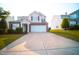 Charming two-story home with manicured lawn and a two car garage at 8021 Wesley Farm Dr, Raleigh, NC 27616
