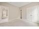 Empty bedroom with walk-in closet and attached bathroom at 900 Green Oaks Pkwy, Holly Springs, NC 27540