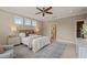 Bedroom with beige walls, white trim and a neutral rug at 900 Green Oaks Pkwy, Holly Springs, NC 27540