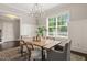 Dining room featuring decorative lighting, a large window, and comfortable seating at 900 Green Oaks Pkwy, Holly Springs, NC 27540