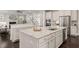 Beautiful kitchen features granite countertops, white cabinets, and stainless steel appliances at 900 Green Oaks Pkwy, Holly Springs, NC 27540