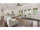 Open-concept living room with a view of the kitchen and access to the outdoors at 900 Green Oaks Pkwy, Holly Springs, NC 27540