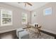 Bright home office with natural light, wood floors, and neutral color scheme at 900 Green Oaks Pkwy, Holly Springs, NC 27540