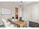 Home office boasts wood desk, neutral tones, and ample storage space at 900 Green Oaks Pkwy, Holly Springs, NC 27540