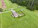 Aerial view of home features yard, outdoor living spaces, fenced playground, and driveway at 9300 Lake Wheeler Rd, Fuquay Varina, NC 27526