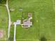 Birds-eye view of home with yard, outdoor living spaces, and surrounding greenery at 9300 Lake Wheeler Rd, Fuquay Varina, NC 27526