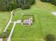 Aerial view of house featuring yard, outdoor living area, and fenced playground at 9300 Lake Wheeler Rd, Fuquay Varina, NC 27526
