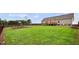 Lush backyard features a play area, seating, and manicured lawn at 9300 Lake Wheeler Rd, Fuquay Varina, NC 27526