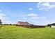Grassy backyard with wooden privacy fence surrounding the yard at 9300 Lake Wheeler Rd, Fuquay Varina, NC 27526